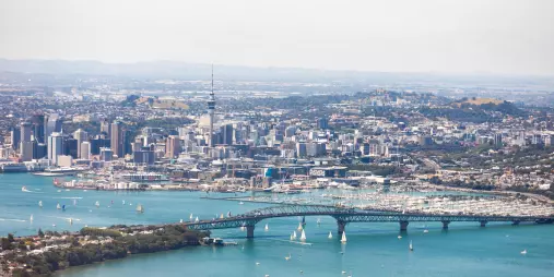 Auckland city and Harbour Bridge with sailing boats