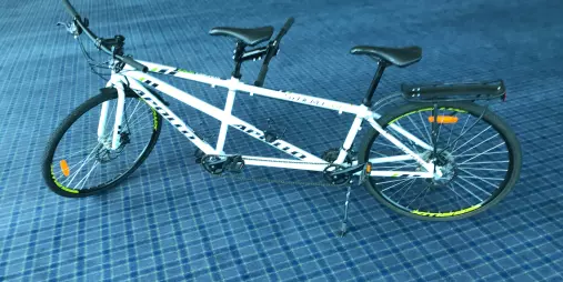 White tandem bike for hire from Nelson Cycle Hire