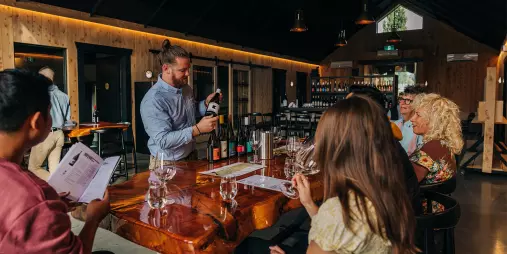Wine expert leading a guided tasting for guests at Kinross in Gibbston Valley